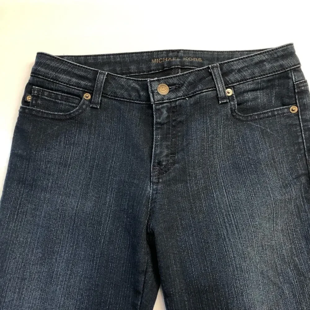 Michael Kors Blue jeans with raw edge folded hem tapered stretch. Size 4.
